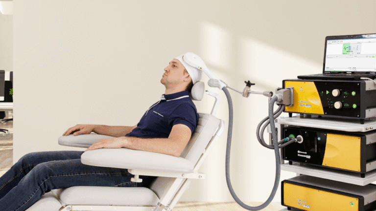 Male patient receiving TMS therapy with Neurosoft Neuro-MS/D system at NeuroSpa Clinic.